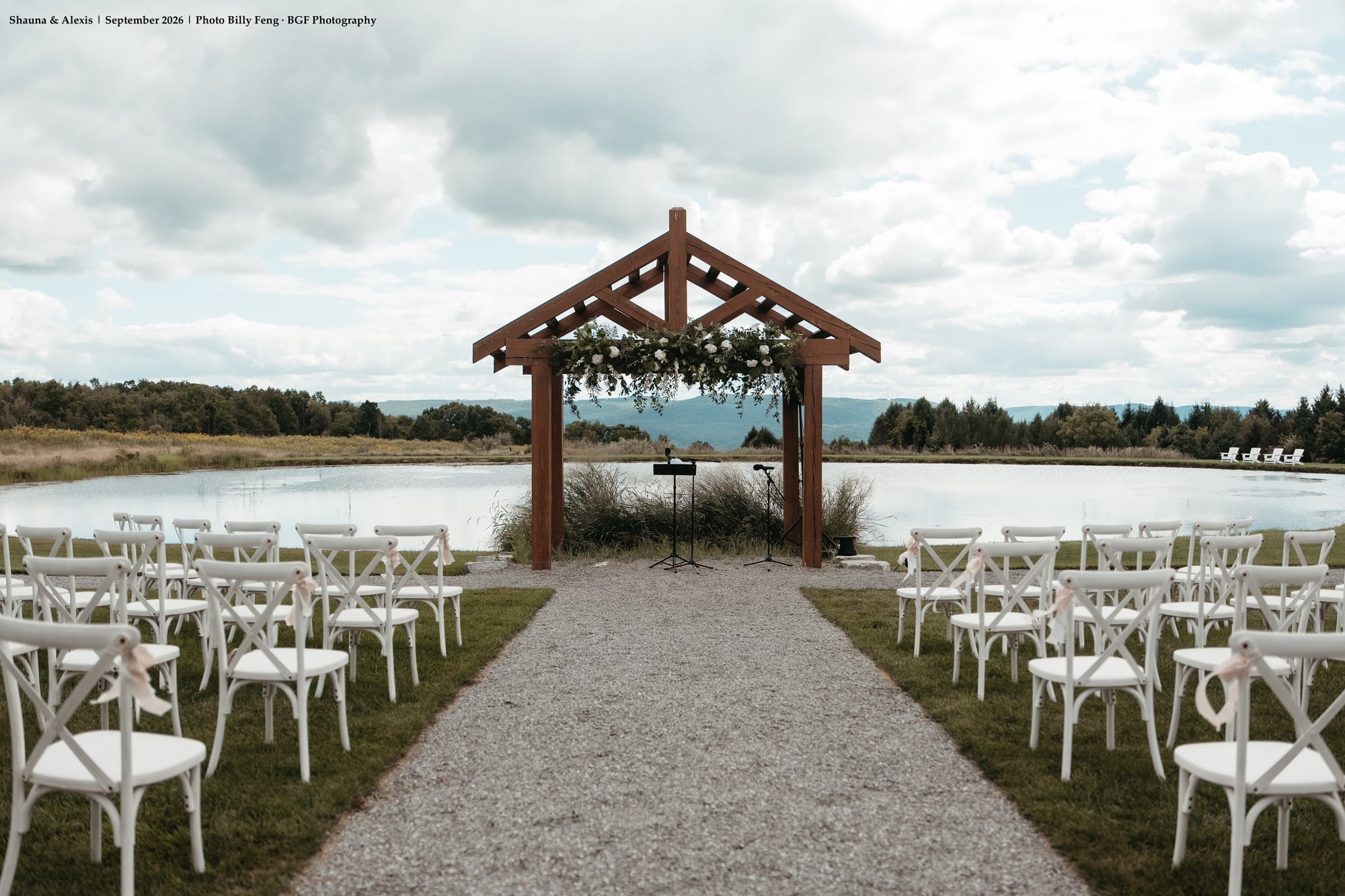 Lakeside wedding ceremony arch overlooking the water