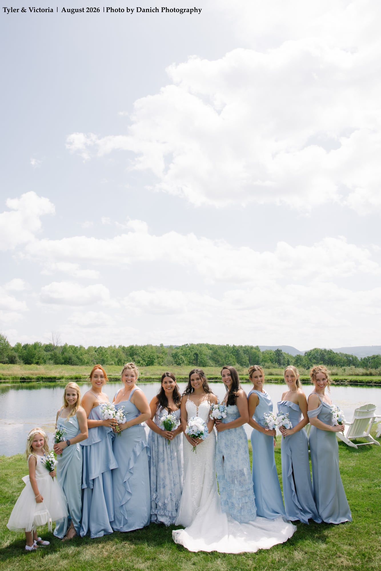 Countryside wedding celebration with bridal party gathered by the lakeside in Kentucky