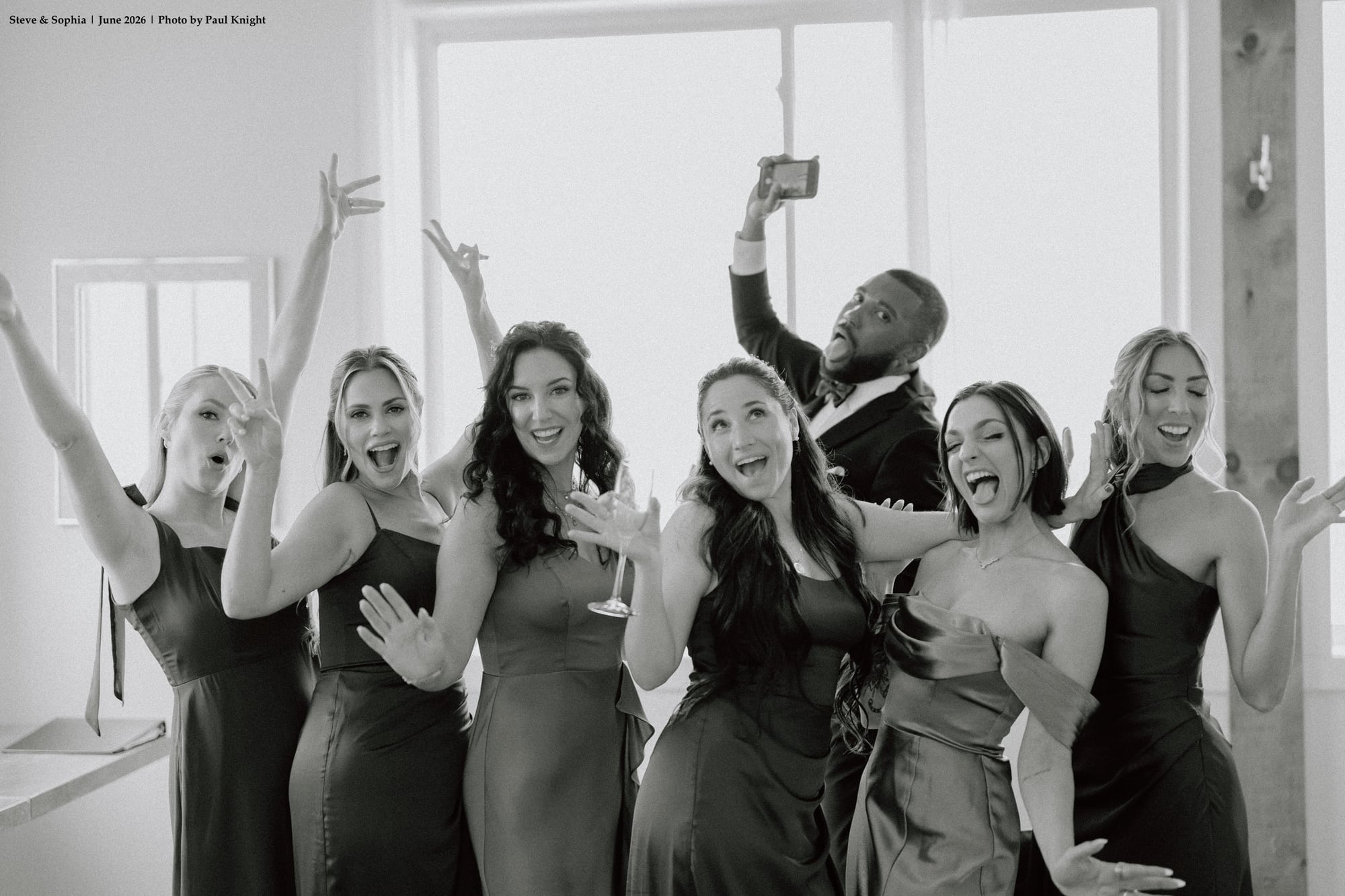 Bridal party cheering with excitement and joy